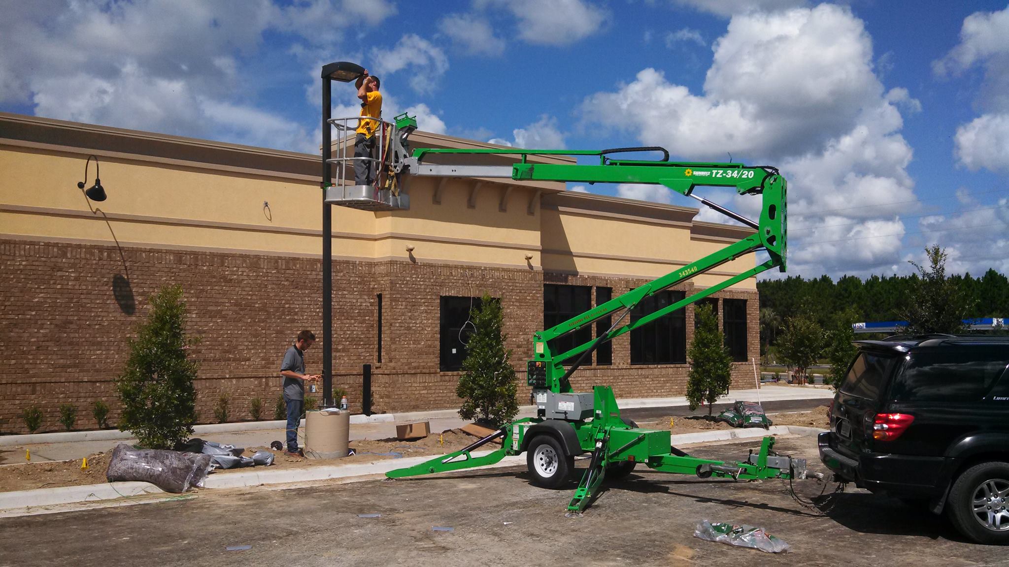 Dan House Electric crew working on a commercial Zaxby's exterior lighting / sign install